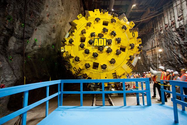 The face of the boring machine- notice the wheels that help it rotate and the giant teeth for cutting rock.